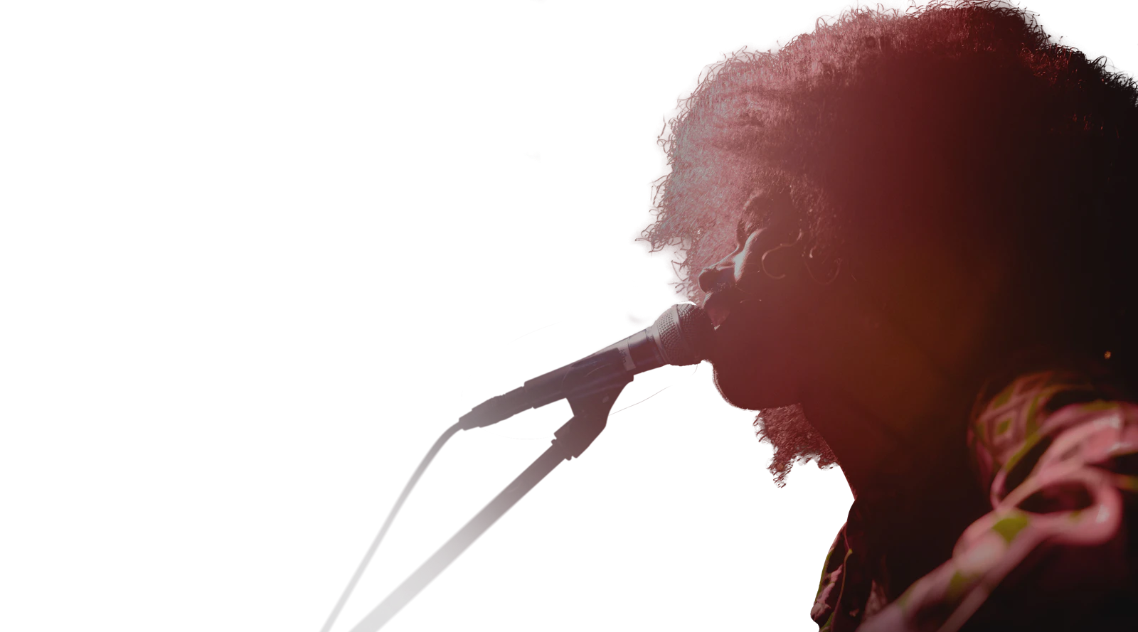 Female singer performing under a pink spotlight
