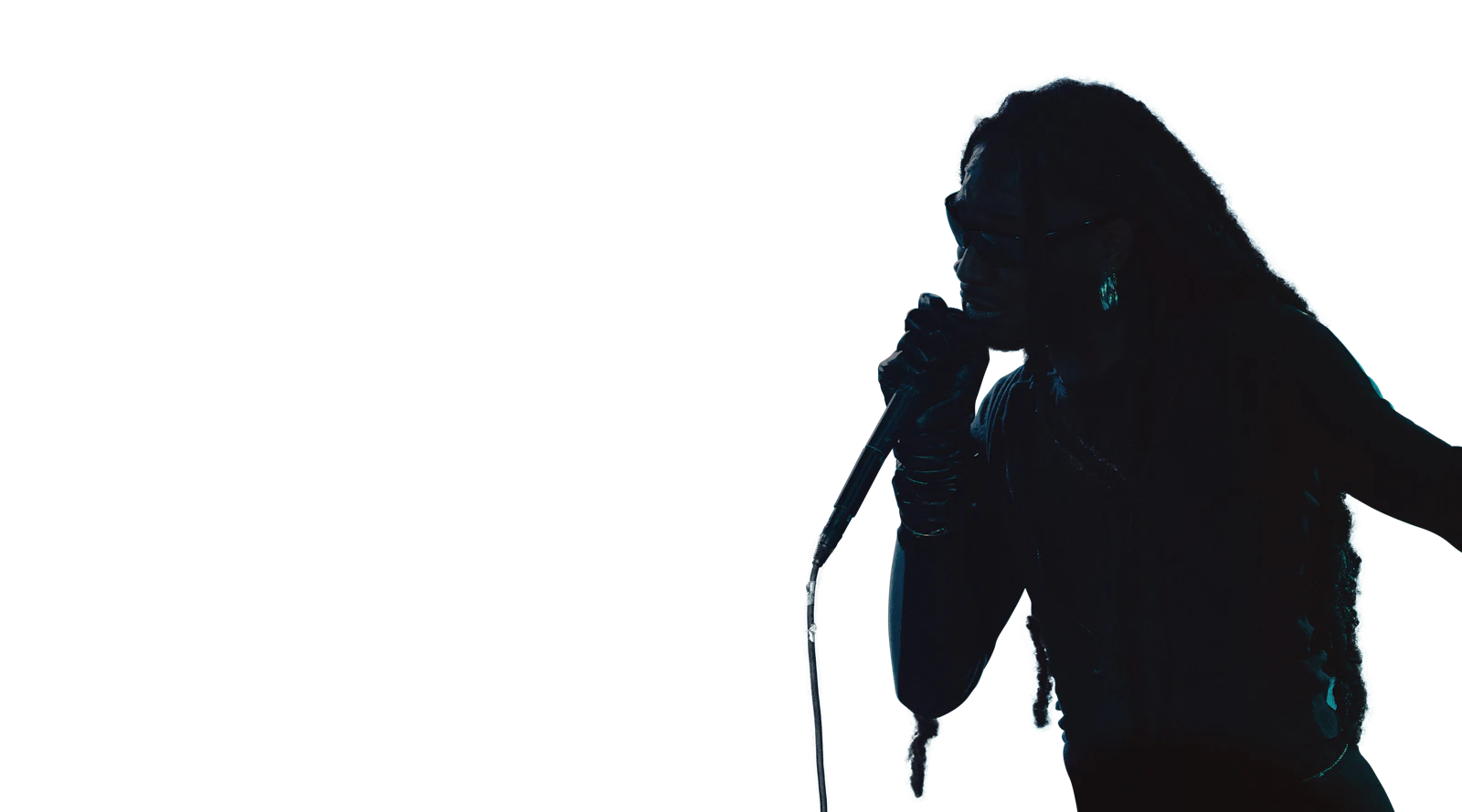 Male singer performing under blue light
